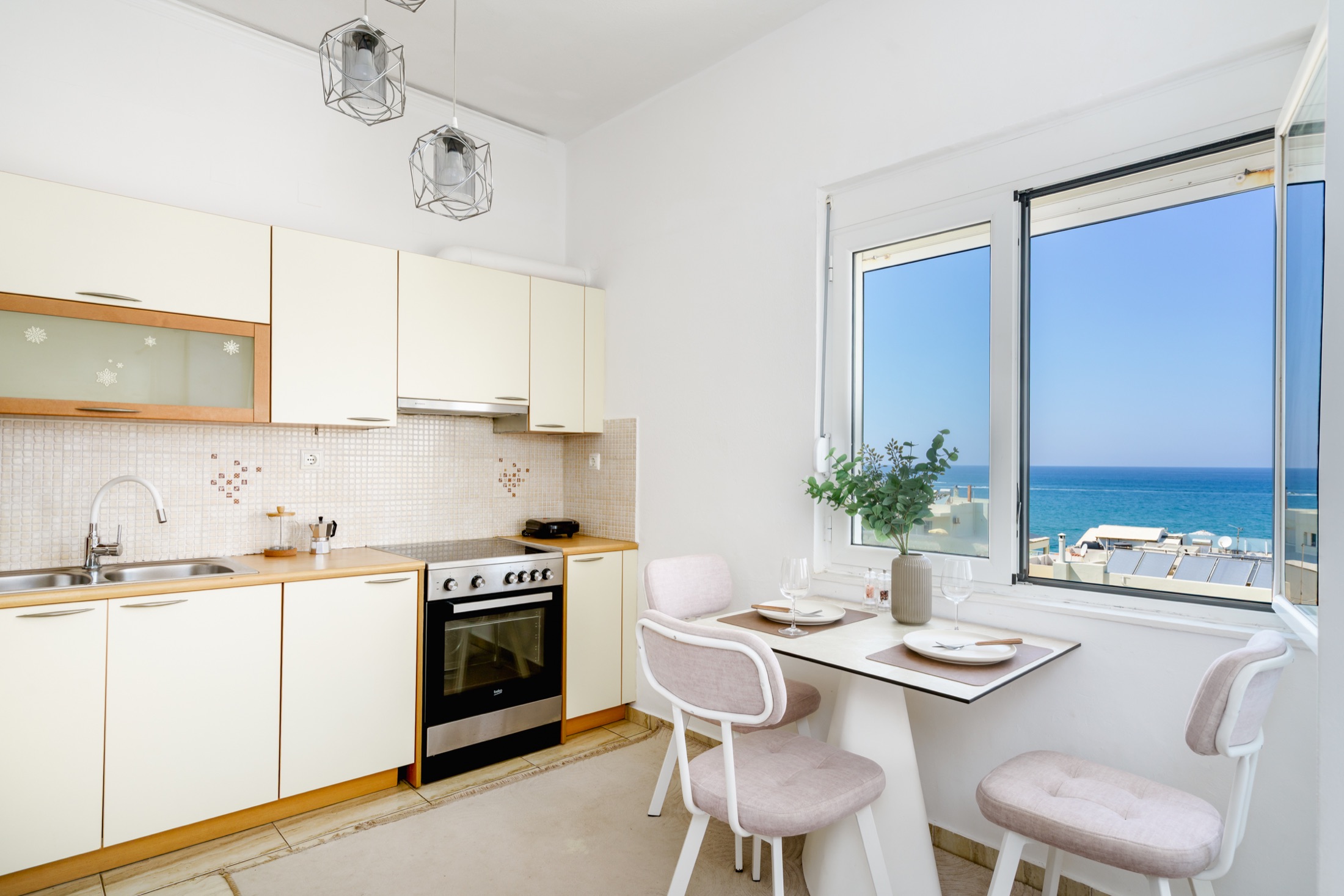 Kitchen and dining table with sea views