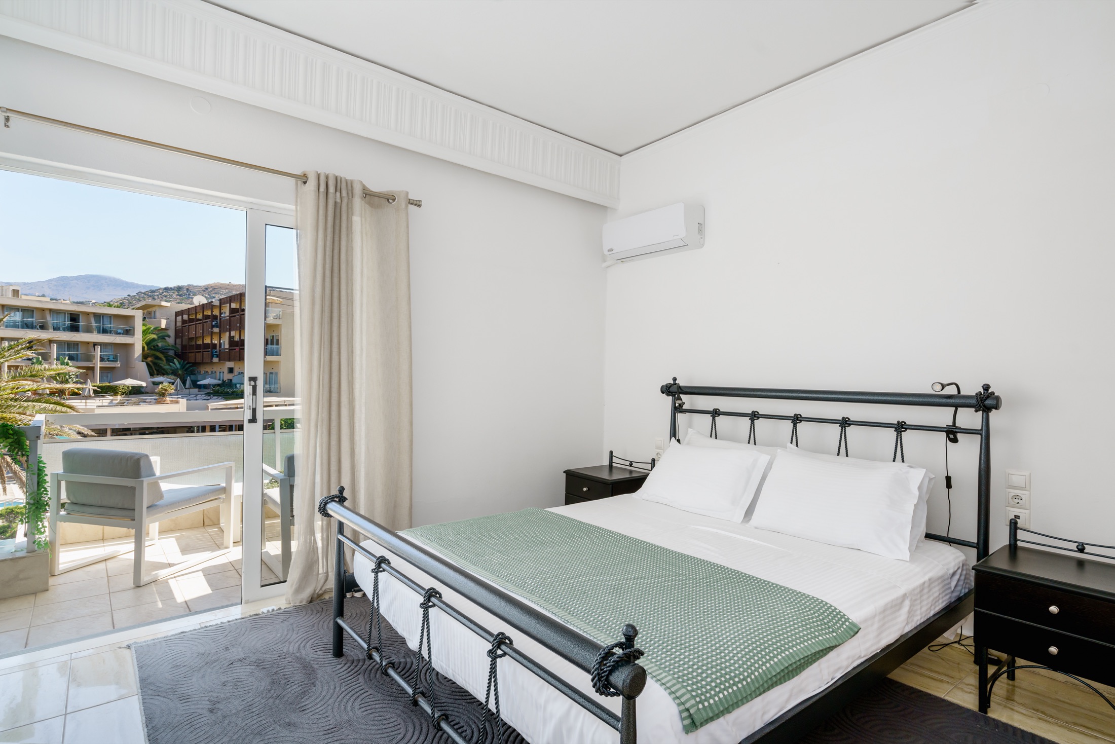 Main bedroom with double bed and private balcony